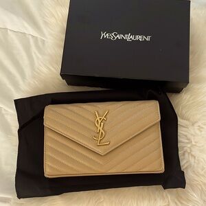 Beige YVES SAINT LAURENT Cassandre Envelope Bag with gold chain.